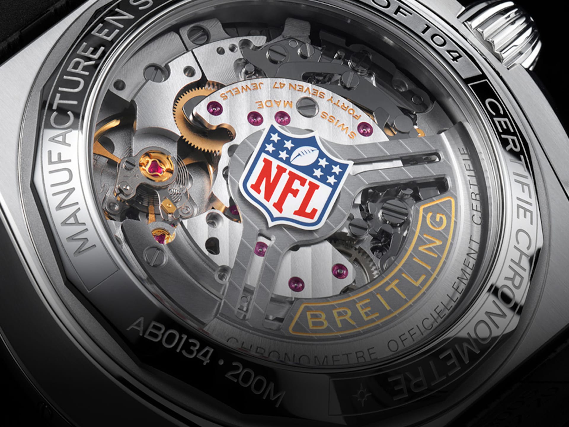 Close-up of a Breitling watch with the NFL logo on the dial