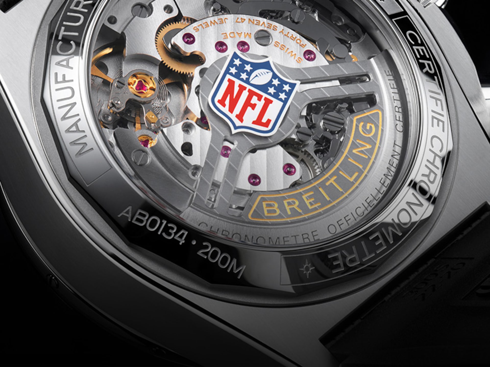Close-up of a Breitling watch with the NFL logo on the dial