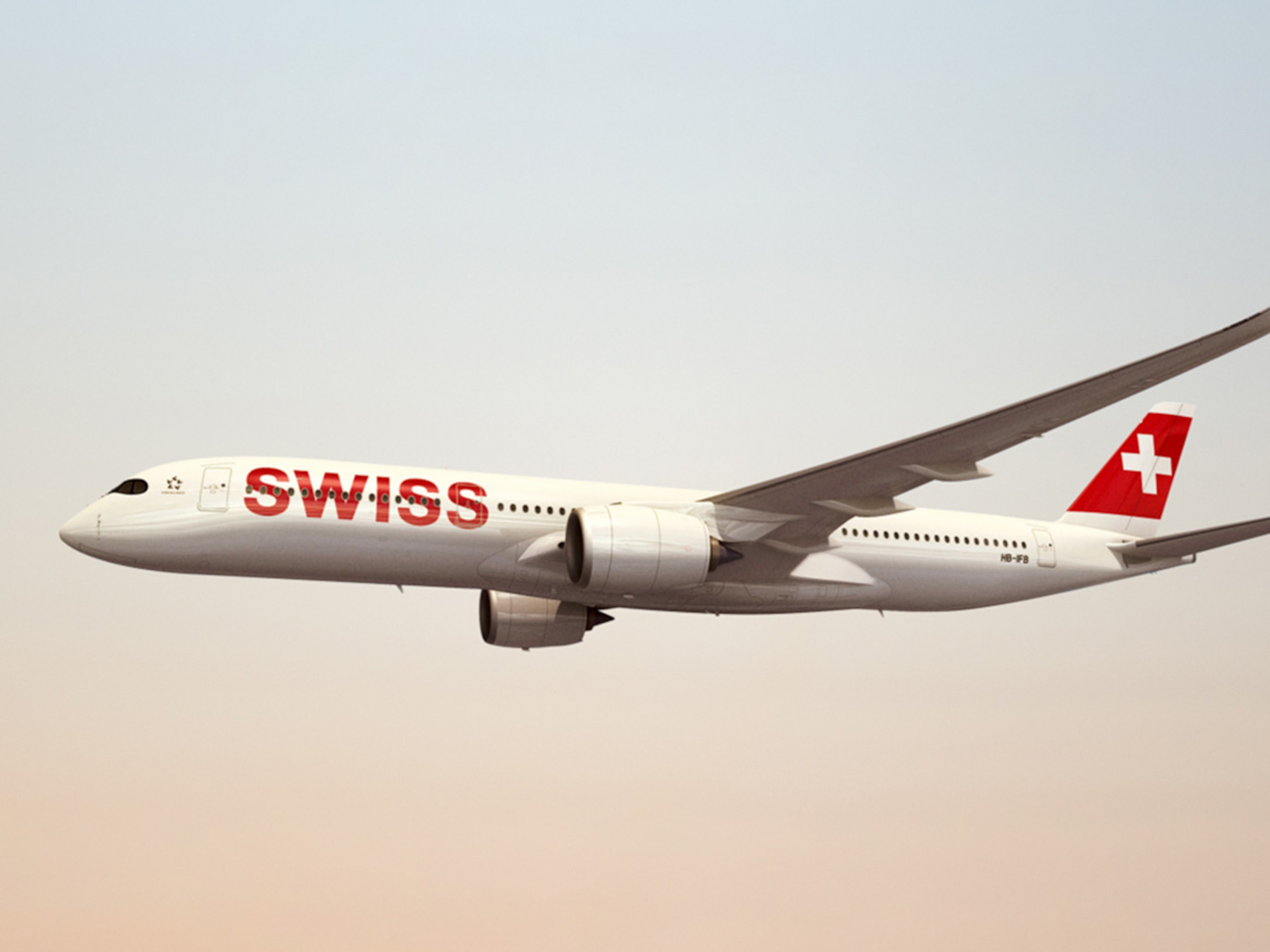 A SWISS aircraft flies over the Alps and represents the partnership between Breitling and SWISS International Air Lines.