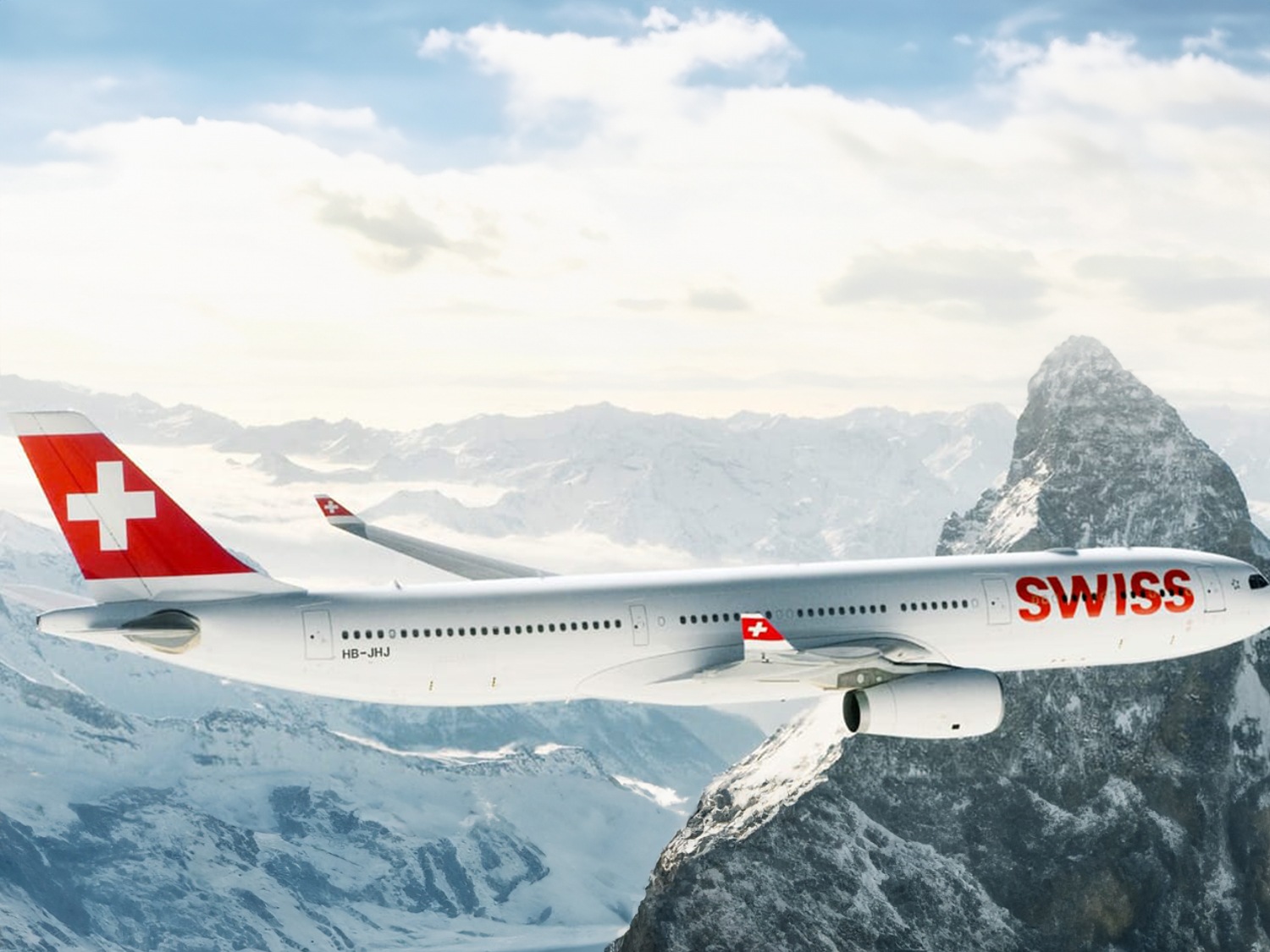 Un avión de SWISS sobrevuela los Alpes y representa la asociación entre Breitling y SWISS International Air Lines.
