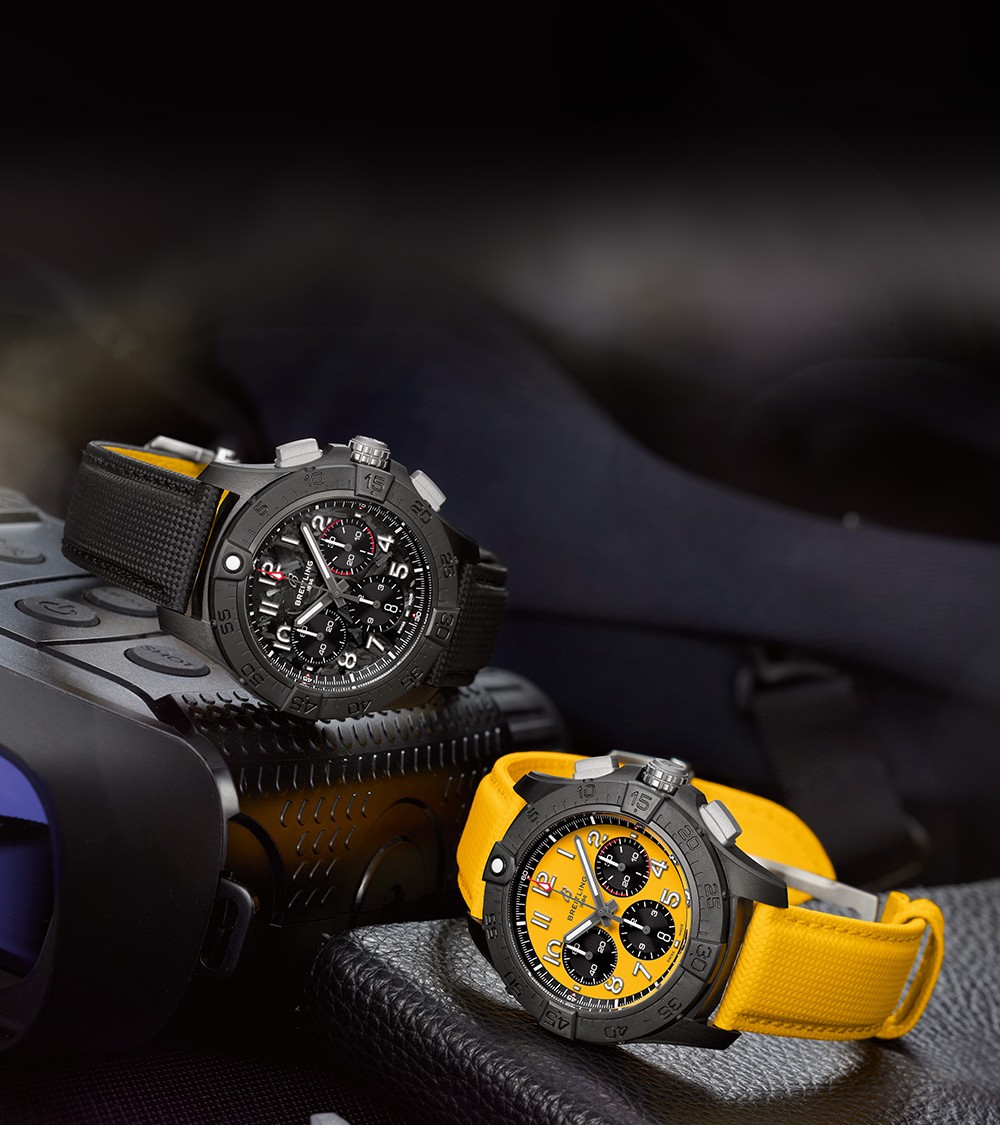 {generated} Breitling陶瓷計時腕錶以黑色與黃色錶帶放置於堅固裝備上展現鮮明的技術氛圍