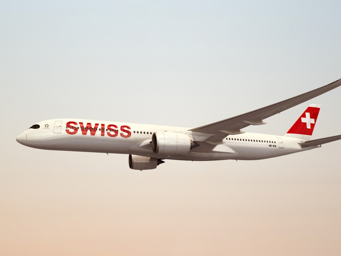 A SWISS aircraft flies over the Alps and represents the partnership between Breitling and SWISS International Air Lines.