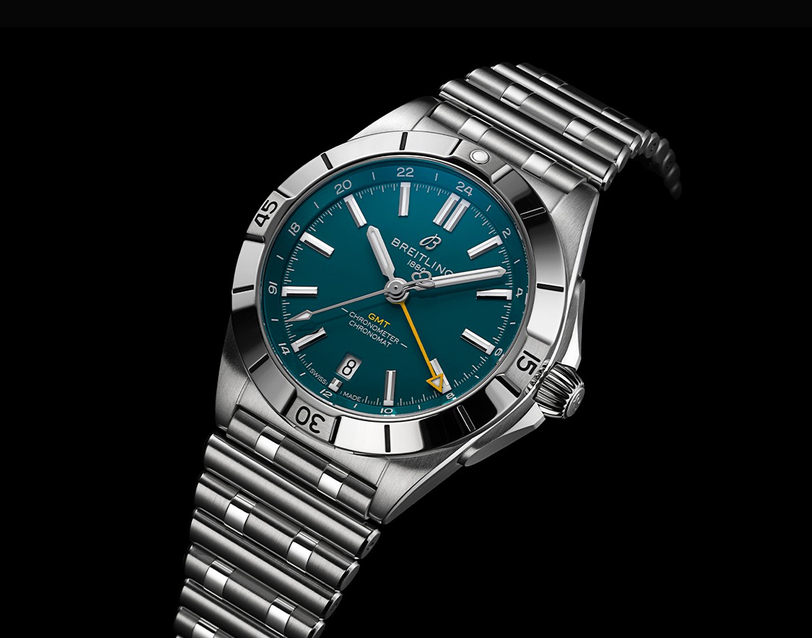 {generated} Breitling Chronomat GMT with teal dial and steel bracelet shown close-up to emphasise its bold detailing and precision