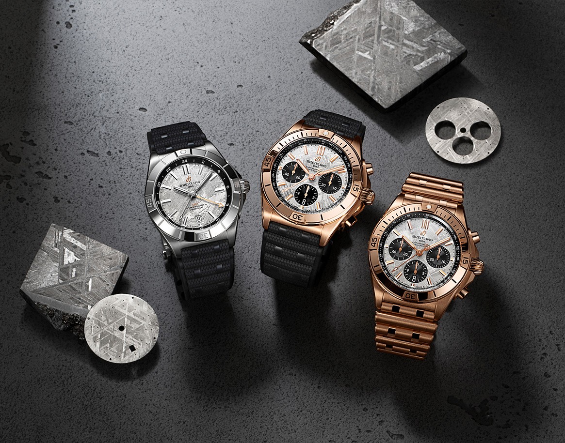 {generated} Breitling Chronomat watches with meteorite dials arranged on dark stone surfaces, highlighting the Erling Haaland collection.
