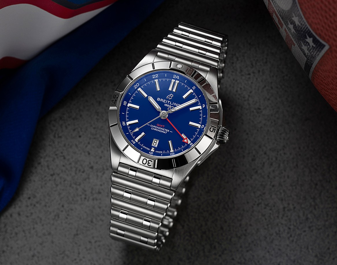 {generated} Breitling Chronomat GMT with a blue dial set beside Buffalo Bills colors and a football, highlighting its bold design.