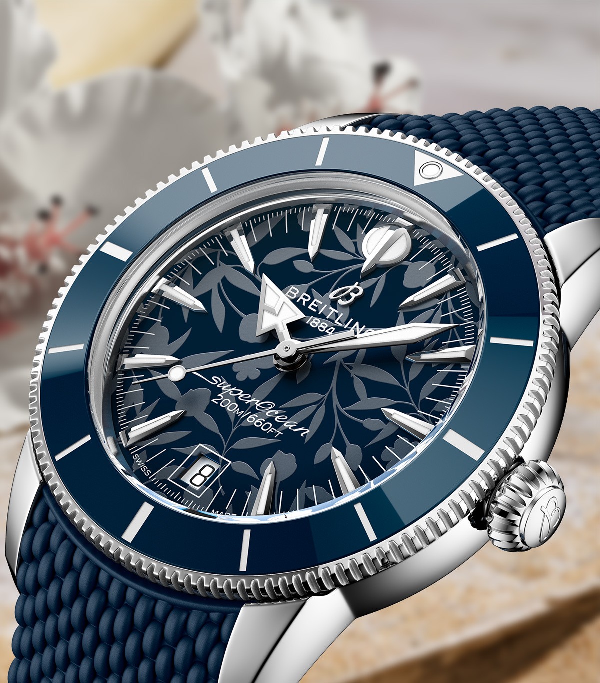 {generated} Breitling Superocean Heritage with blue floral dial and textured strap shown in a close-up with Kelly Slater