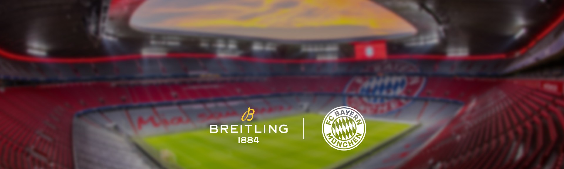 {generated} A blurred football stadium backdrop framing centred Breitling and FC Bayern logos highlighting their partnership.