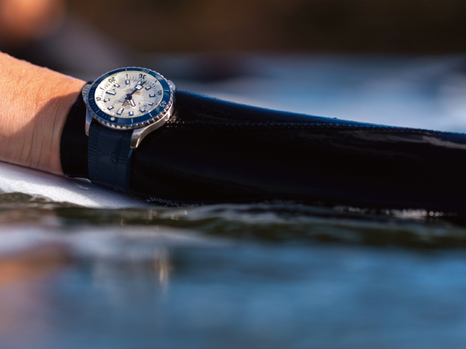{generated} A diver’s arm emerges from the water showcasing a Breitling watch, highlighting durability and precise seal maintenance.