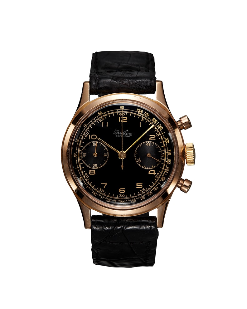 {generated} Breitling Premier ref. 777 Venus 175 with a gold case, black dial and leather strap shown on a simple white background