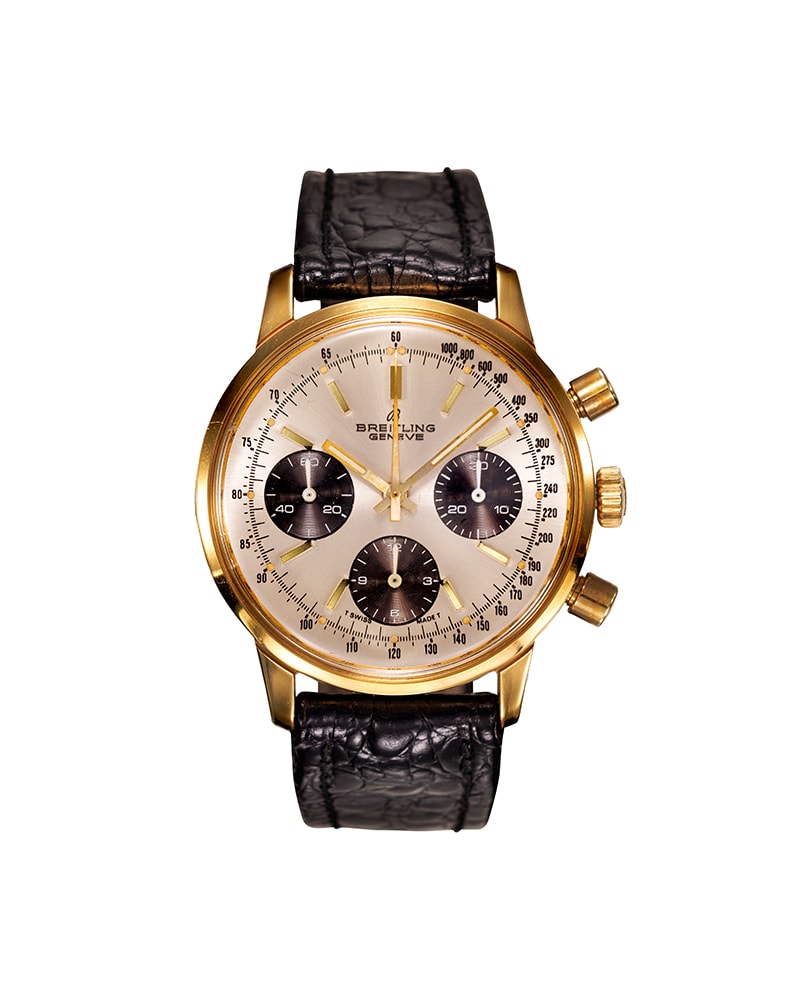 {generated} Breitling Top Time Long Playing ref. 815 con cassa cronografo dorata, quadranti scuri e cinturino in pelle nera testurizzata