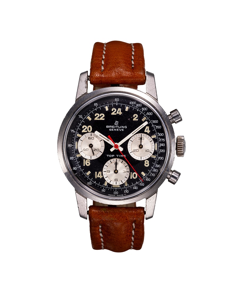 {generated} Breitling Top Time ref.824 Venus 178 con quadrante nero, contatori crema, lancetta rossa cronografo e cinturino in pelle marrone