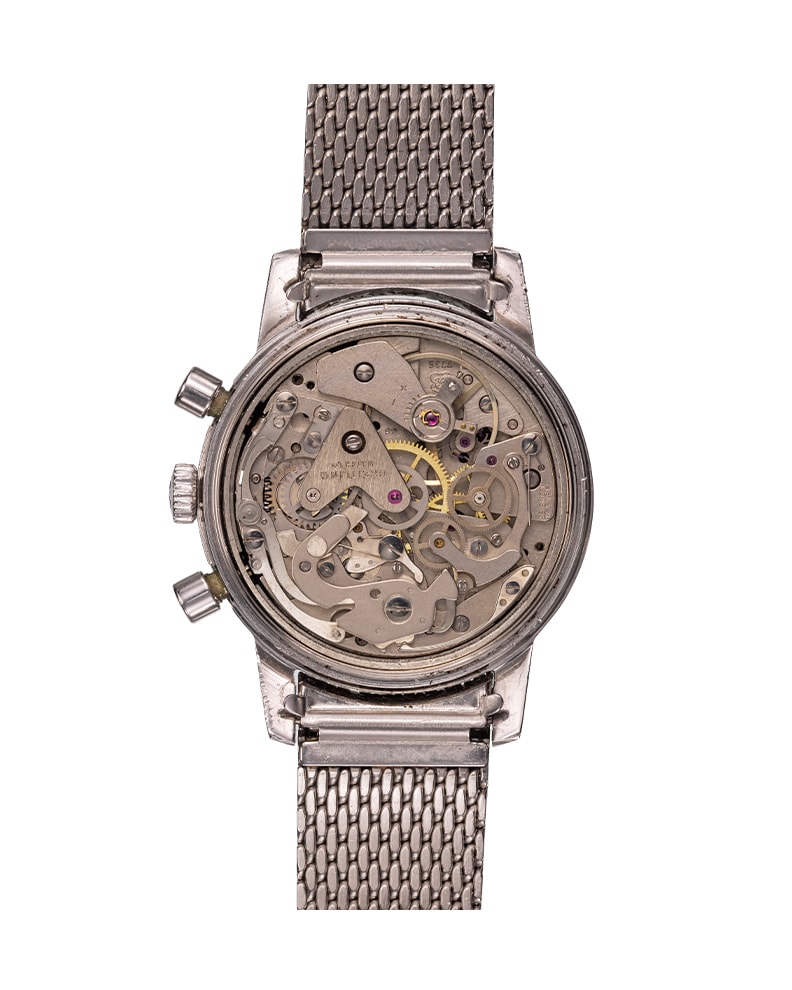 {generated} Breitling Top Time ref. 815 Valjoux 7736 vintage con quadrante argento, contatori scuri e bracciale in maglia d’acciaio