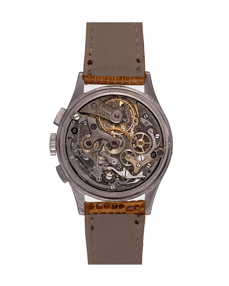 {generated} Vintage Breitling Datora ref.785 chronograph shown with a cream dial, blue accents, and a stitched brown leather strap