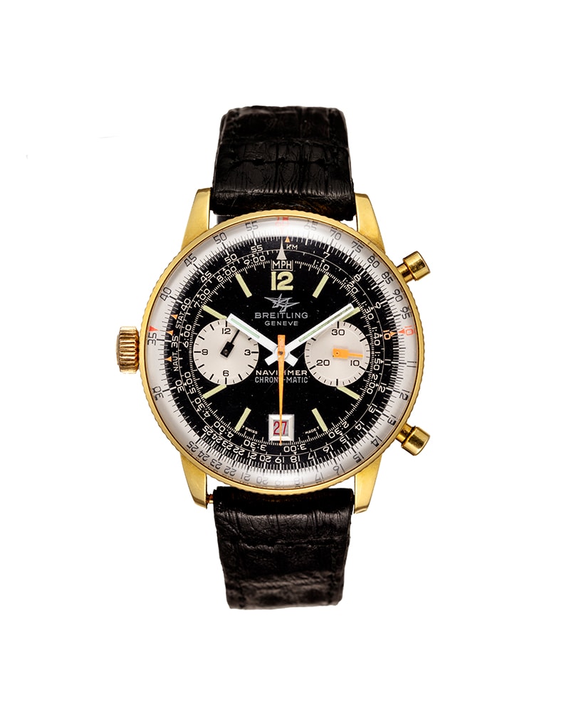 {generated} 金色ケースに黒い文字盤と黒いレザーストラップを備えたBreitling Navitimer Chrono-matic Mk10 ref.8806が白背景に示される。