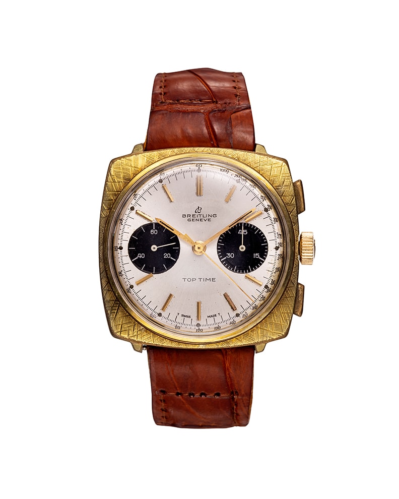 {generated} Orologio vintage Breitling Top Time Square ref. 2009 con cassa dorata, quadrante argento e cinturino in pelle marrone.