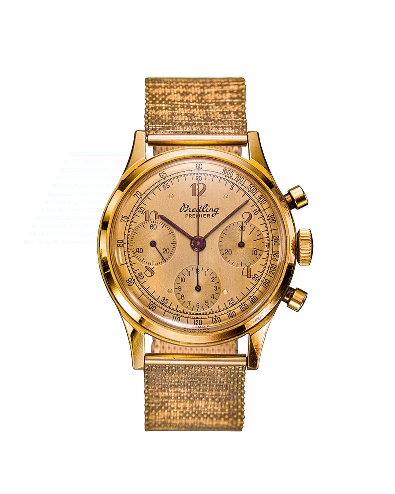 {generated} Vintage gold Breitling Premier ref.753 Valjoux R69 chronograph with three subdials and a matching gold mesh strap.