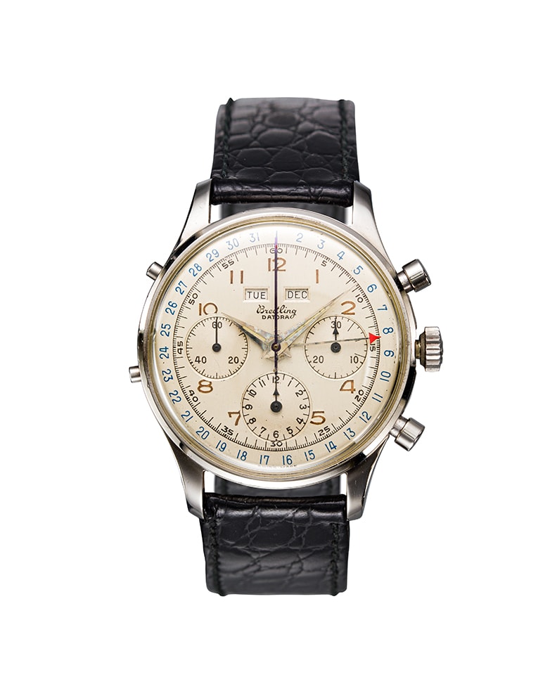 {generated} Breitling Datora ref.804 Valjoux VZHC/72C with cream dial, triple calendar display and black leather strap shown upright.