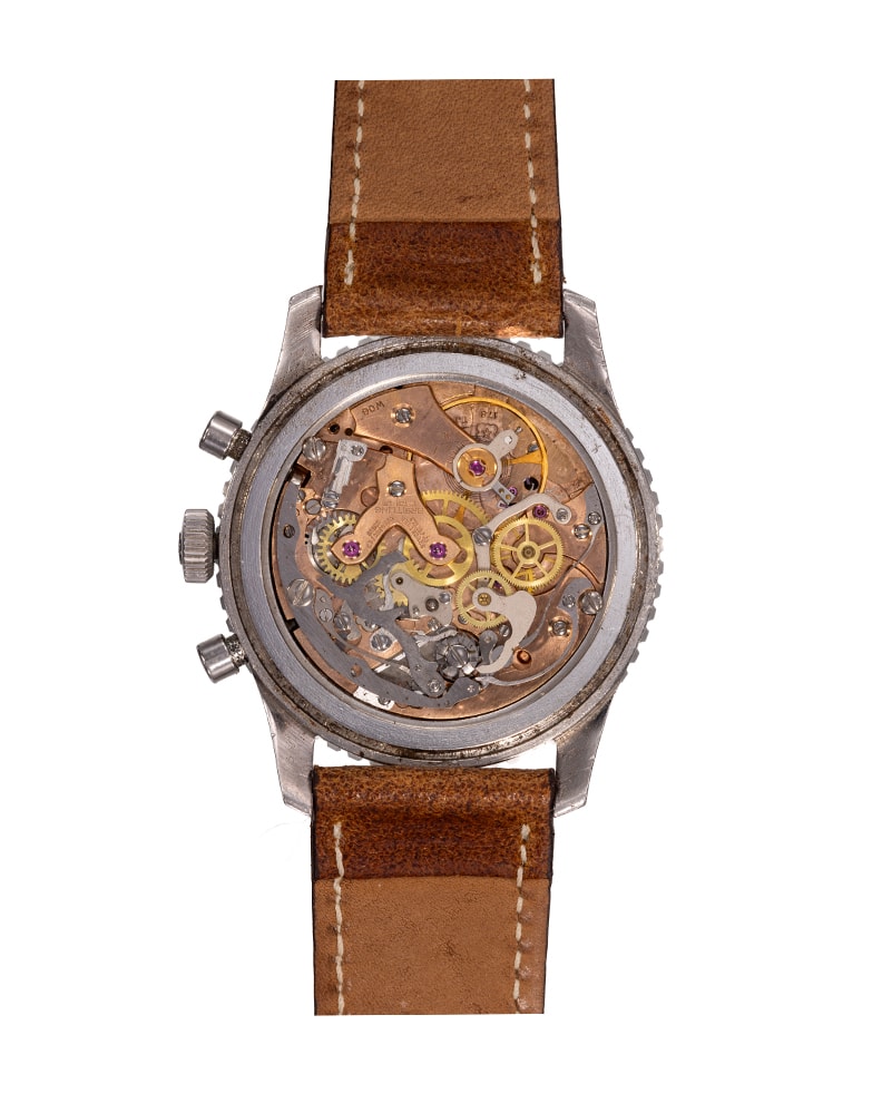 {generated} ヴィンテージのBreitling Navitimer Mk8 ref.806 Venus 178で、黒い文字盤とトリコンパックス配置、茶革ストラップを備える。