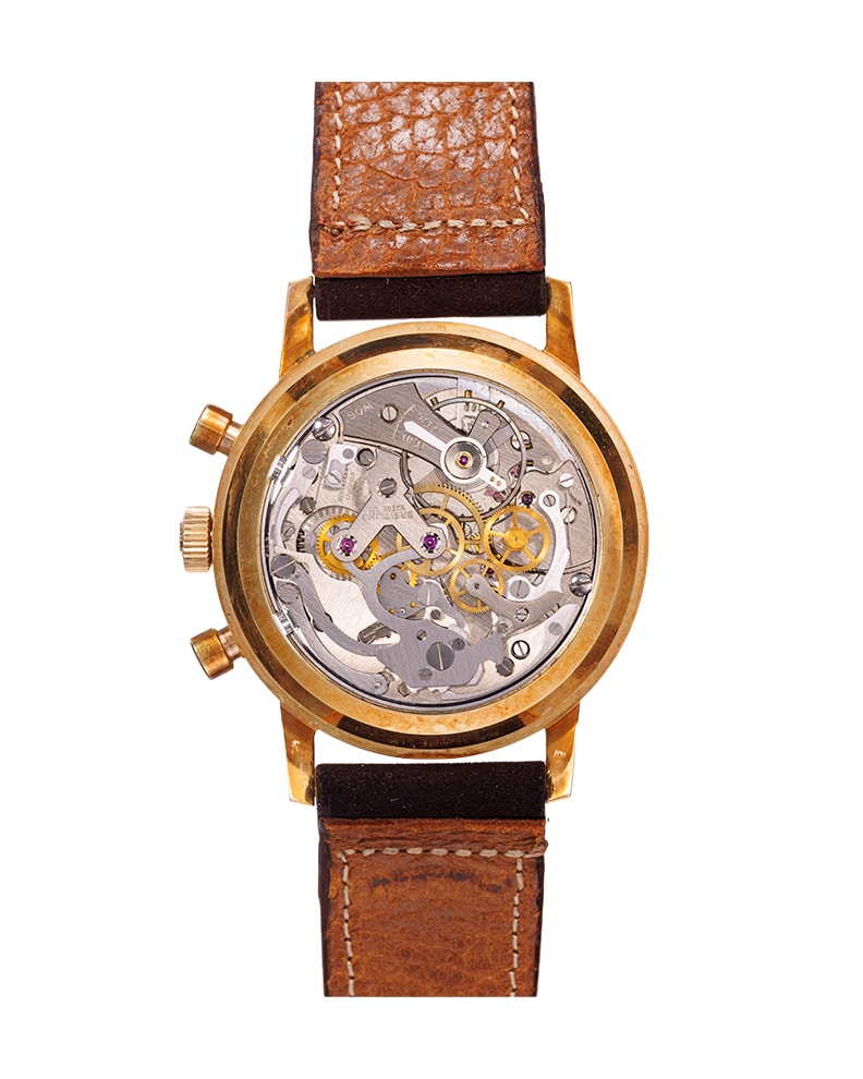 {generated} Breitling Top Time ref.2004 Venus 188 con cassa dorata, quadrante argento, due contatori e cinturino in pelle marrone.