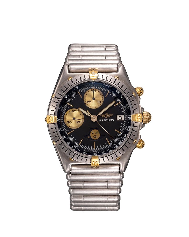 {generated} ステンレスブレスとゴールド装飾を備えたBreitling Chronomat Luna 81950の暗いダイヤルと精緻なクロノグラフ。