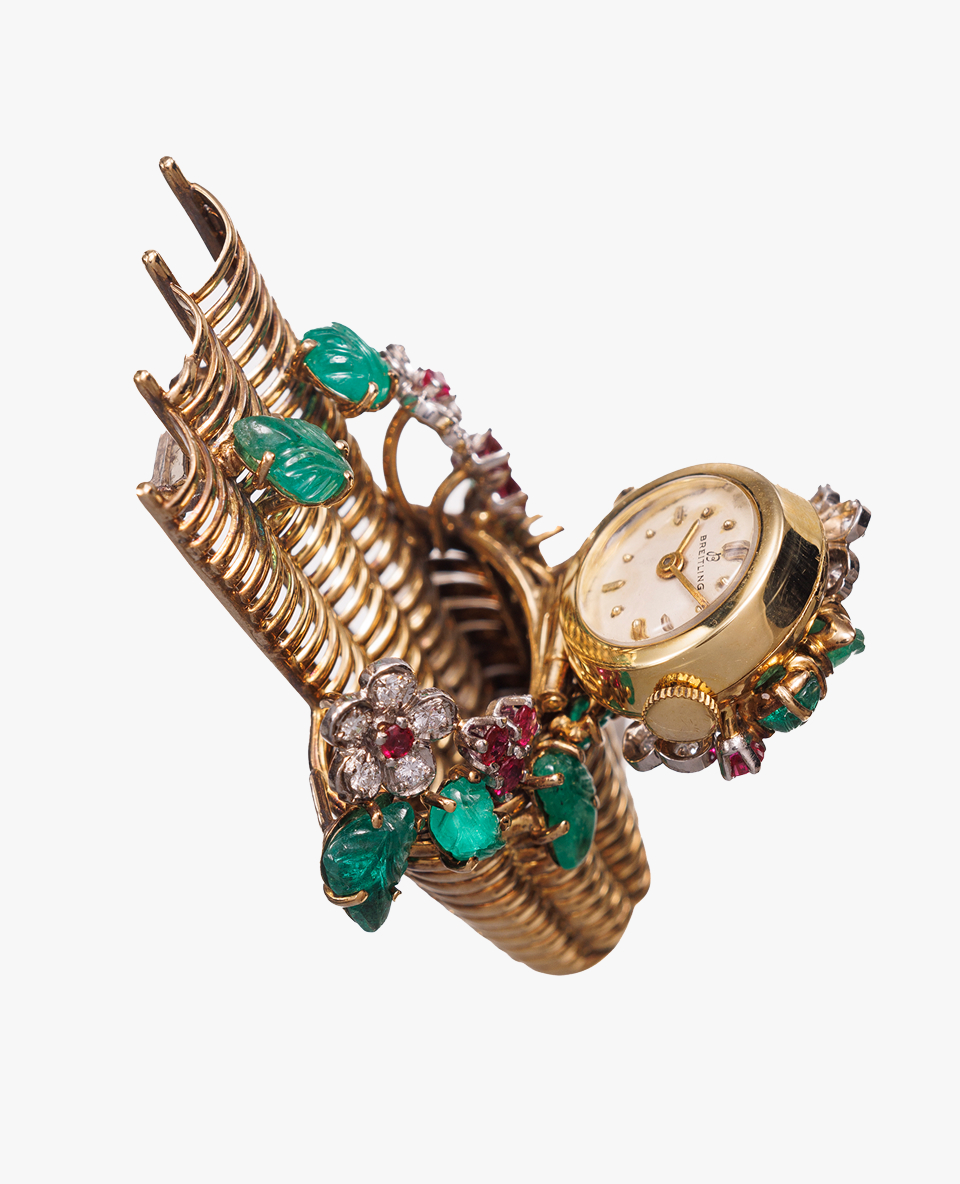 {generated} 精緻金色手鐲搭載復古Breitling腕錶並飾以寶石花卉細節，展現優雅風格