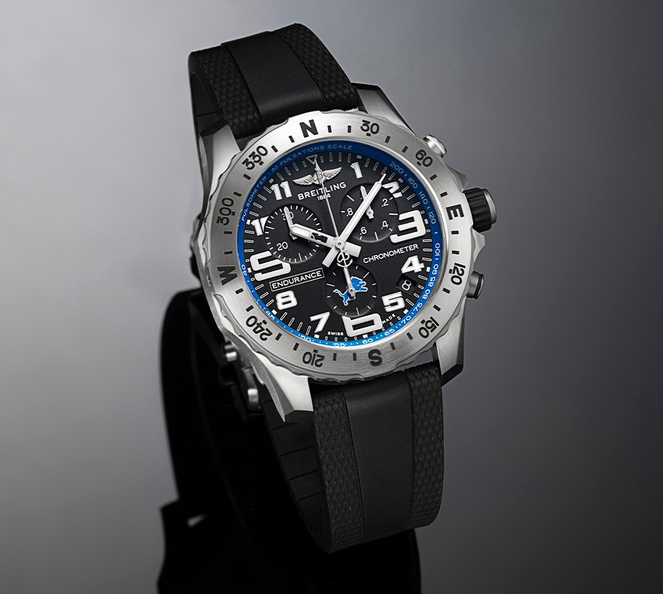 {generated} Breitling Endurance Pro watch with black dial, blue Detroit Lions accents and rubber strap shown in a studio view