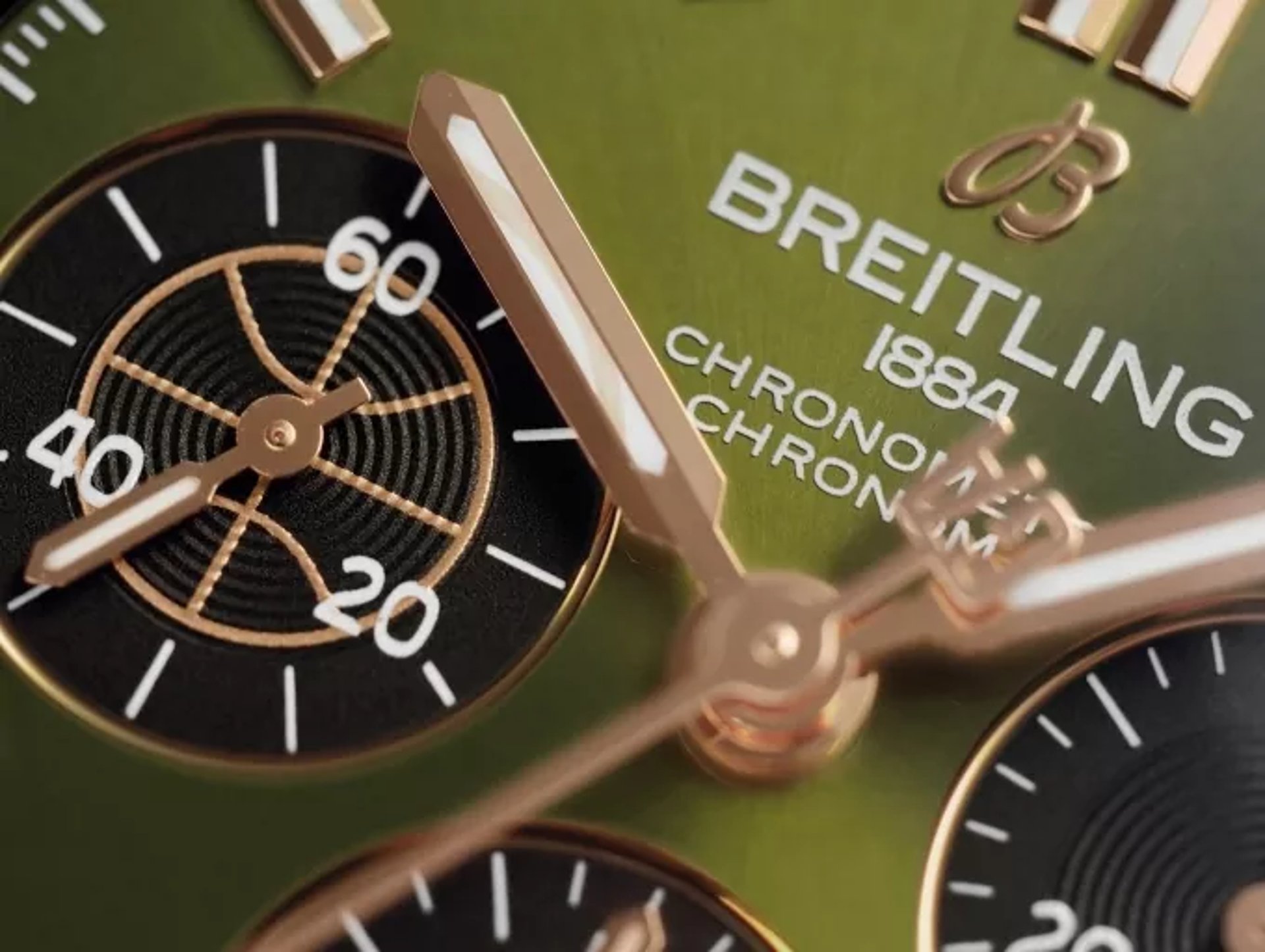{generated} Close-up of a green Breitling chronograph dial highlighting rose-gold hands, detailed subdials, and refined finishing