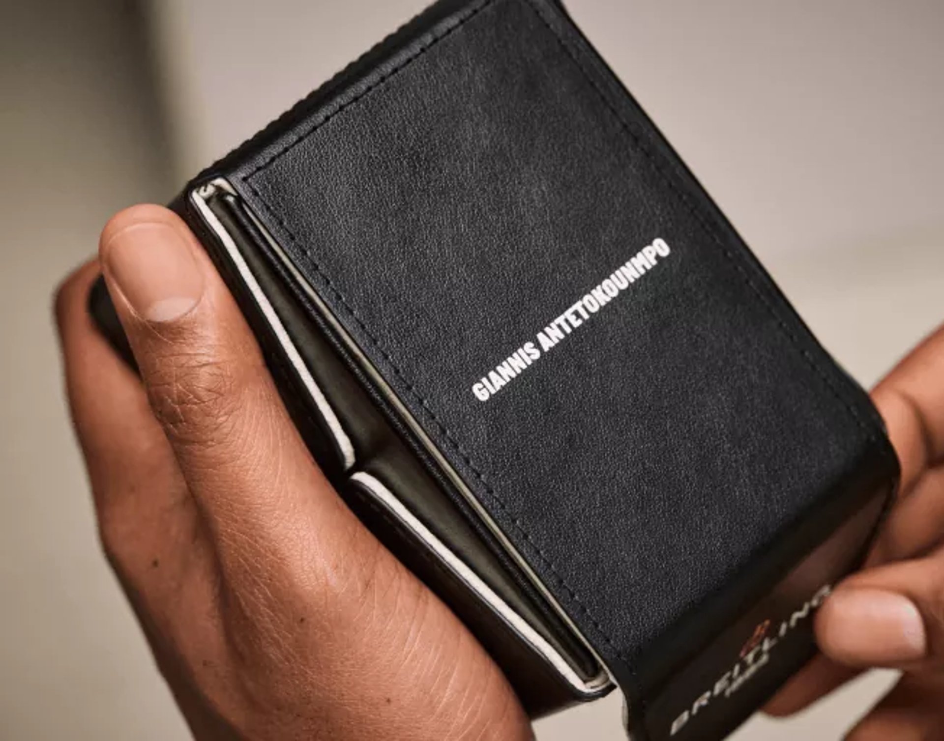 {generated} Breitling limited‑edition caseback with Giannis Antetokounmpo’s engraved signature and precise model markings in steel