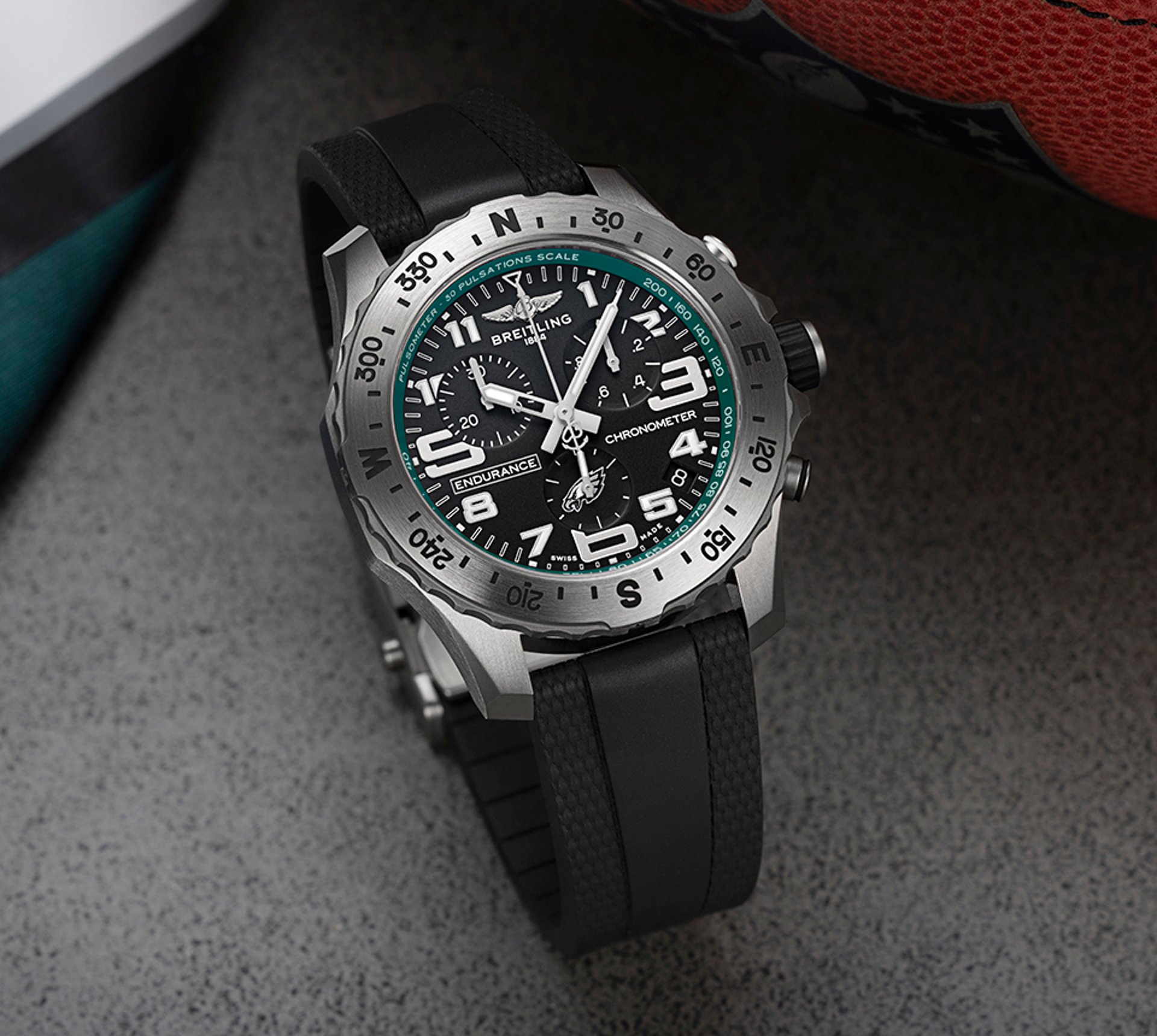 {generated} Breitling Endurance watch with black dial and Eagles accents shown close-up against sporty gear to highlight its design