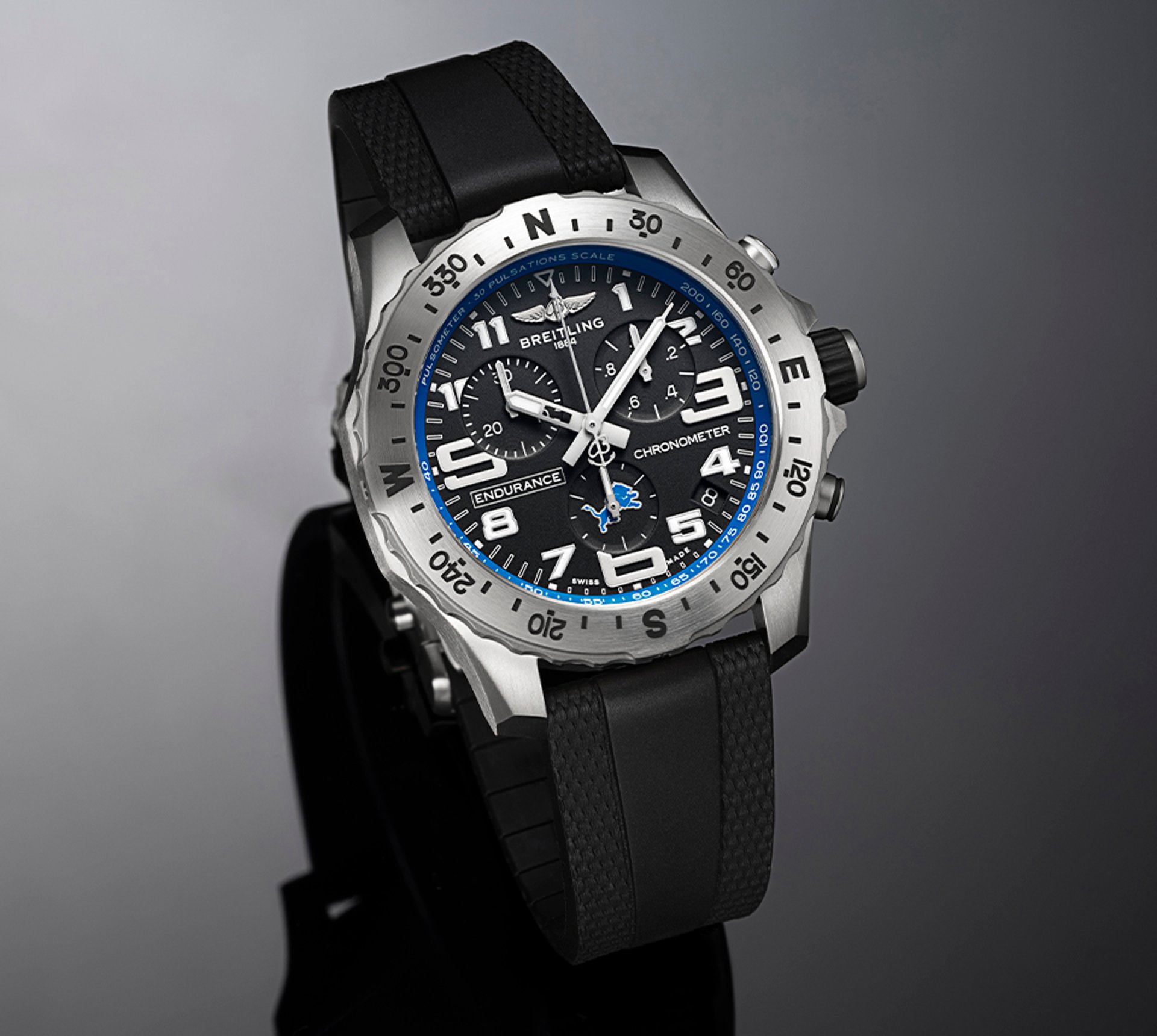 {generated} Breitling Endurance Pro watch with black dial, blue Detroit Lions accents and rubber strap shown in a studio view
