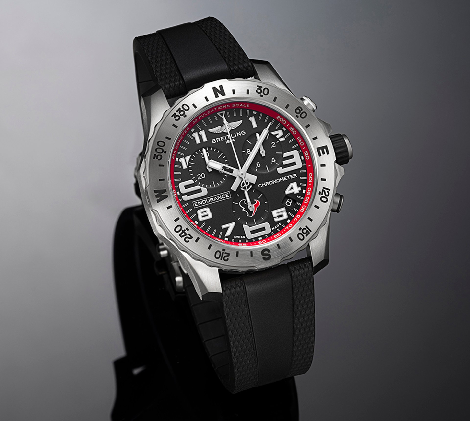 {generated} Breitling Endurance Pro watch with black dial, red accents, and rugged strap presented in a polished studio setting