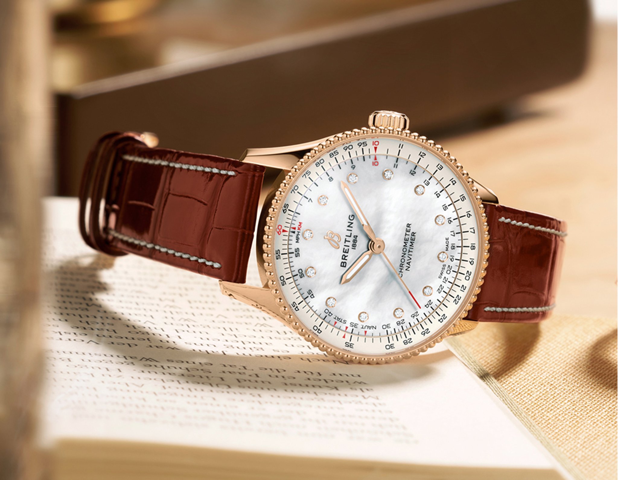 {generated} Breitling Navitimer with rose-gold case, white dial and brown leather strap displayed in warm light atop an open book
