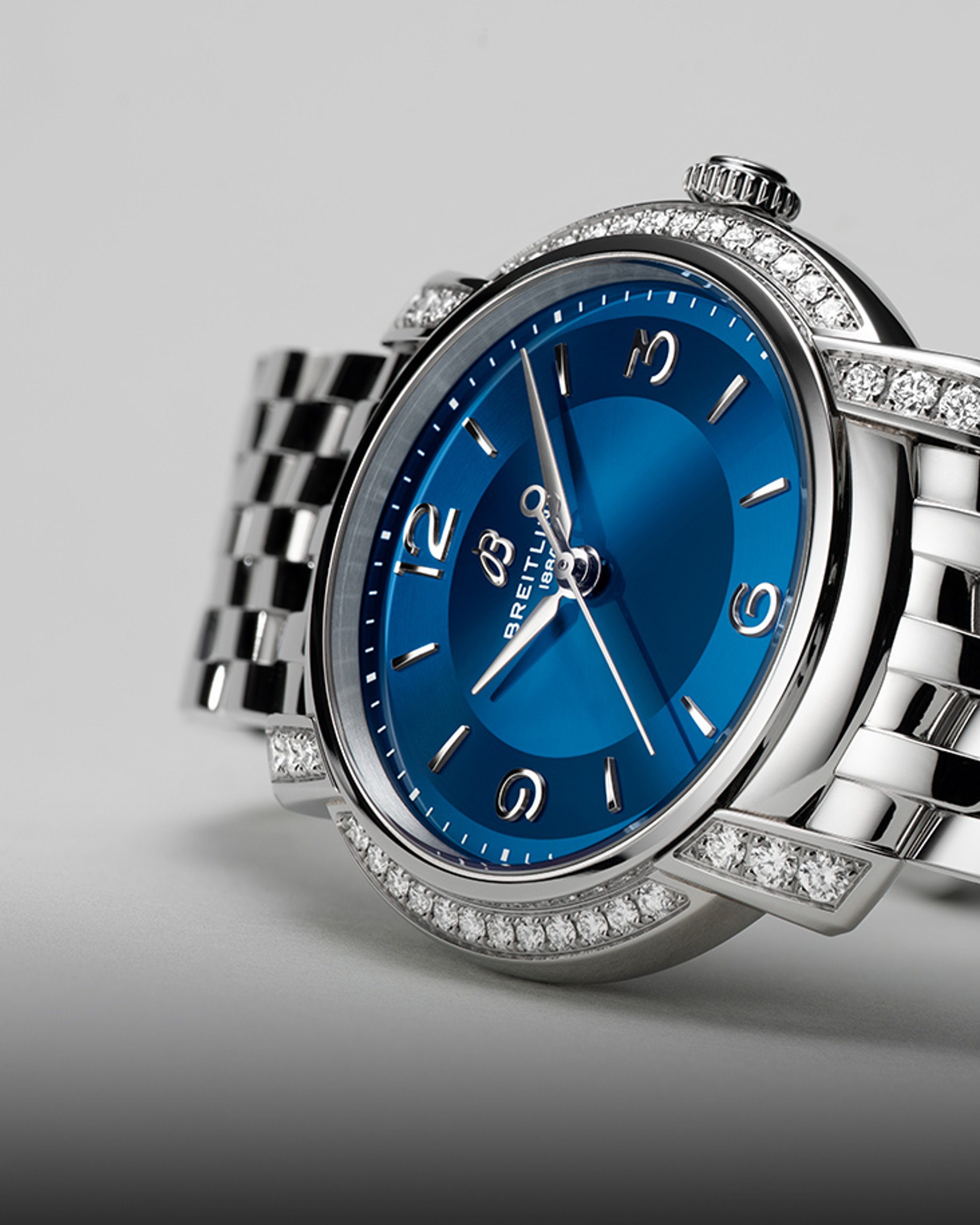 {generated} Breitling Lady Premier women’s watch with blue dial, diamond‑set bezel and polished bracelet shown in close detail