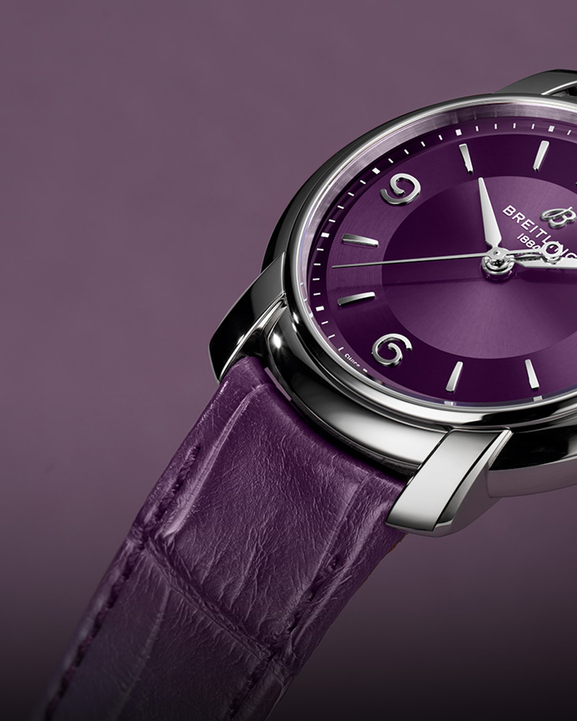{generated} Breitling Lady Premier presented with a purple dial and matching leather strap, highlighting its polished steel case.