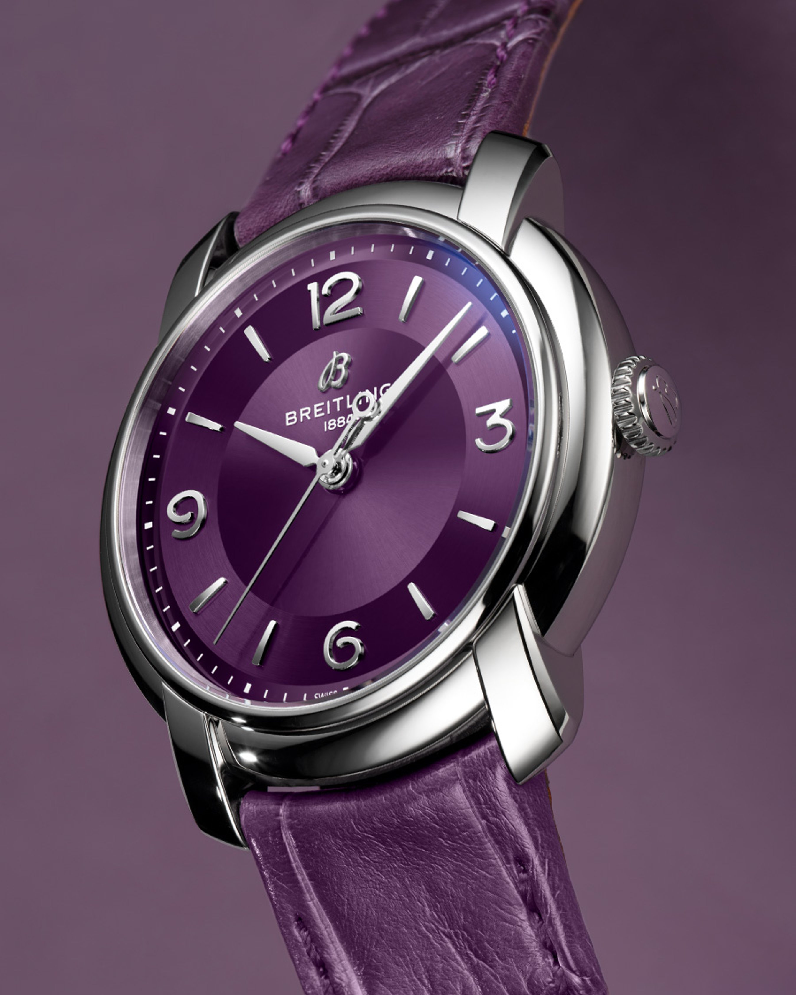 {generated} Breitling Lady Premier presented with a purple dial and matching leather strap, highlighting its polished steel case.