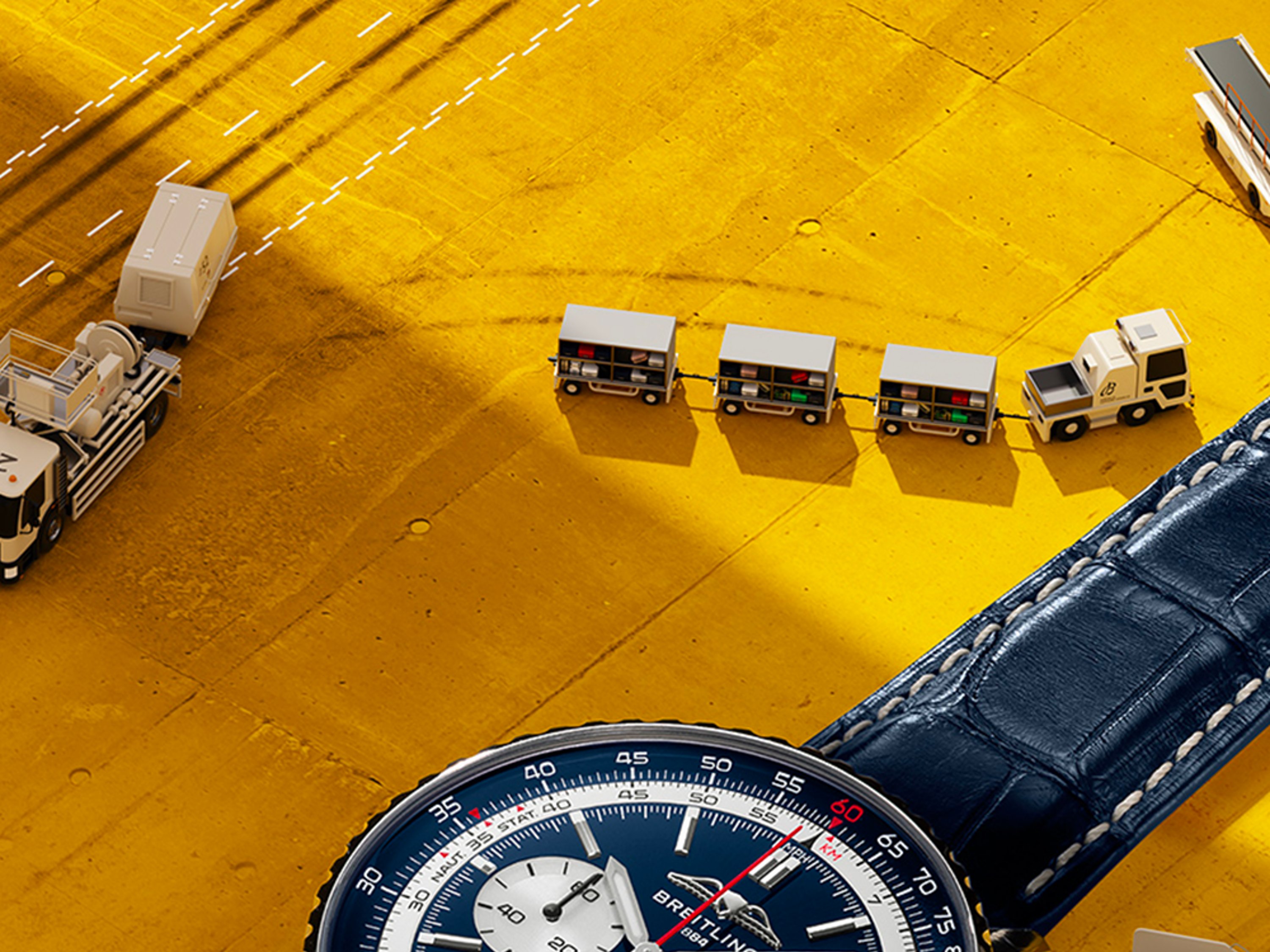 Navitimer with a light blue dial and Navitimer with a black dial on a table.