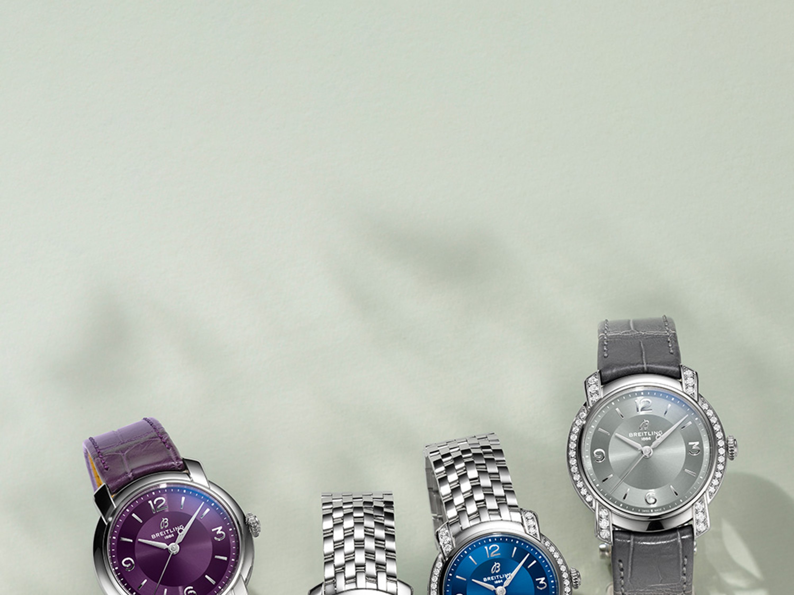{generated} Breitling Lady Premier watches presented with purple, white, blue, and grey dials showcasing refined new designs