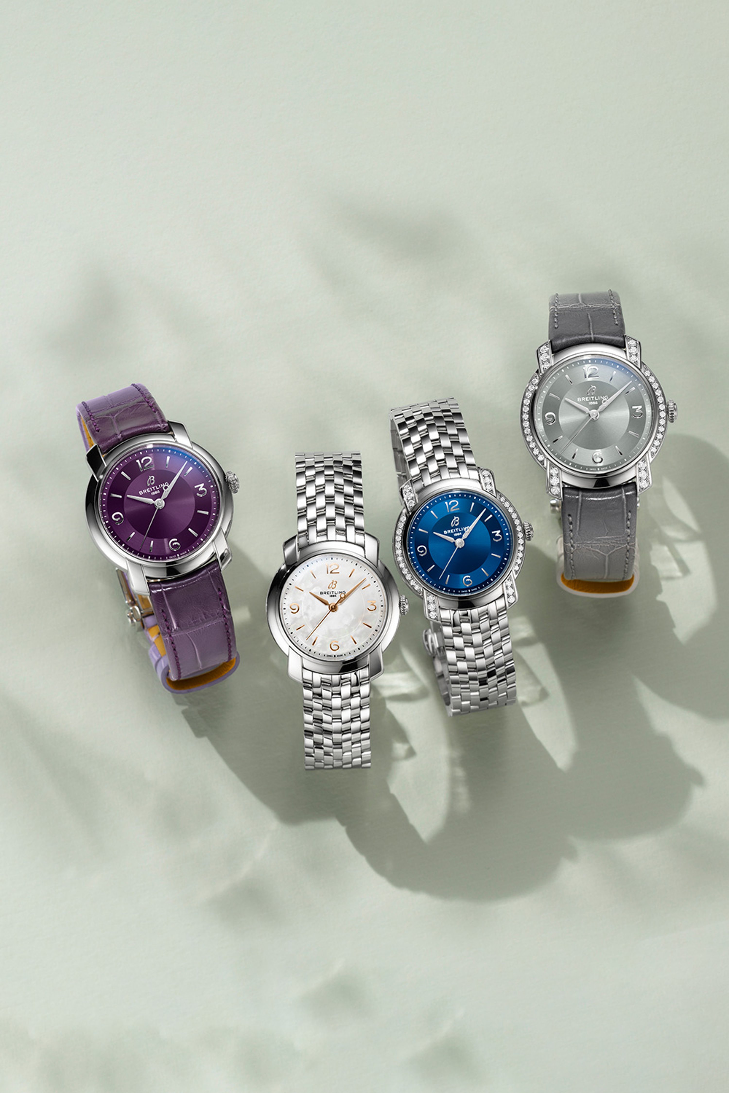{generated} Breitling Lady Premier watches presented with purple, white, blue, and grey dials showcasing refined new designs
