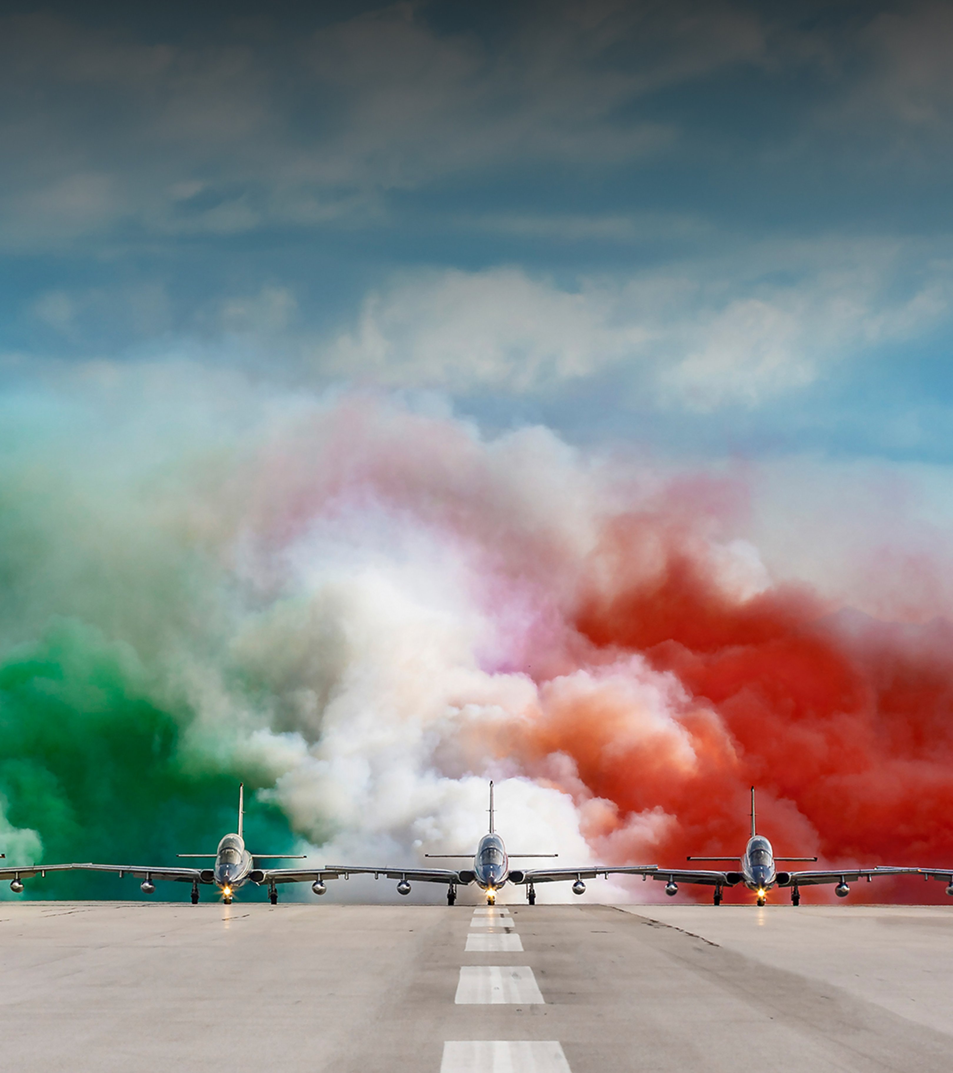 {generated} Frecce Tricolori jets advance on the runway amid green, white, and red smoke, reflecting Breitling’s aviation heritage.