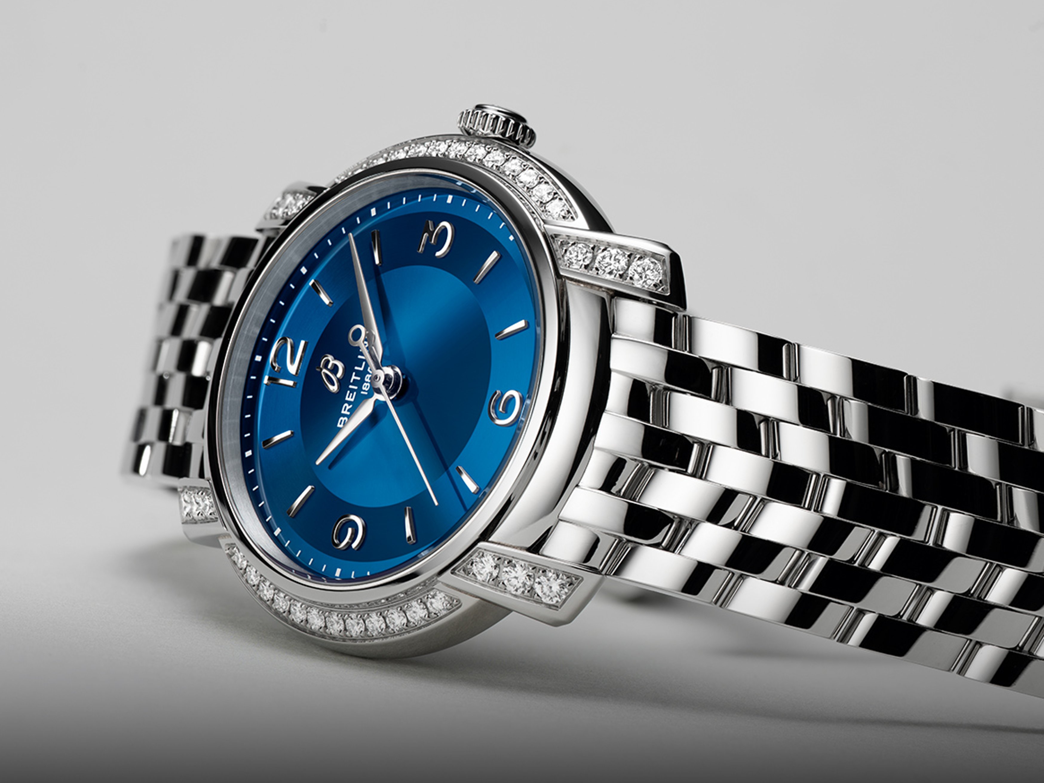 {generated} Breitling Lady Premier women’s watch with blue dial, diamond‑set bezel and polished bracelet shown in close detail