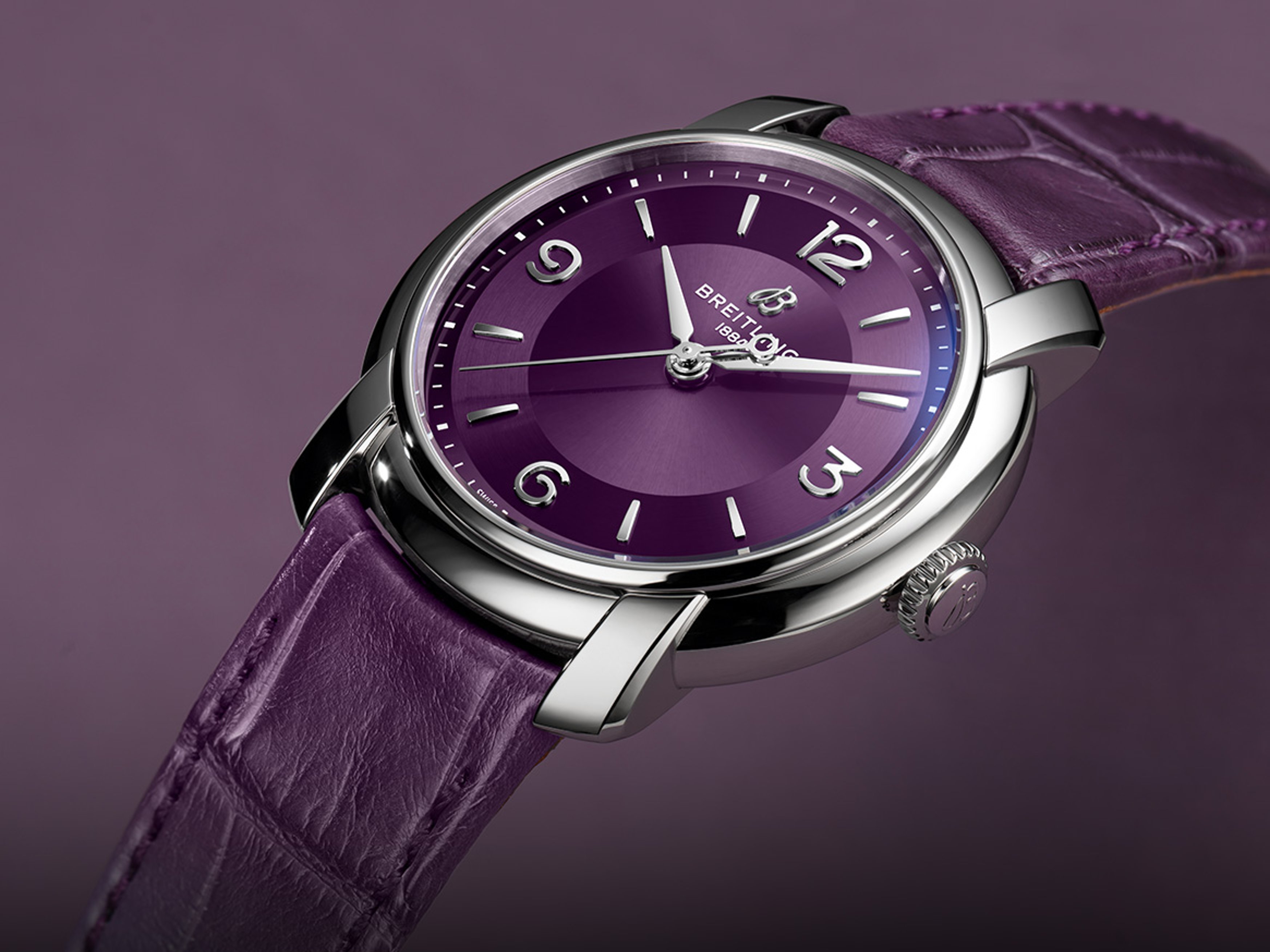 {generated} Breitling Lady Premier presented with a purple dial and matching leather strap, highlighting its polished steel case.