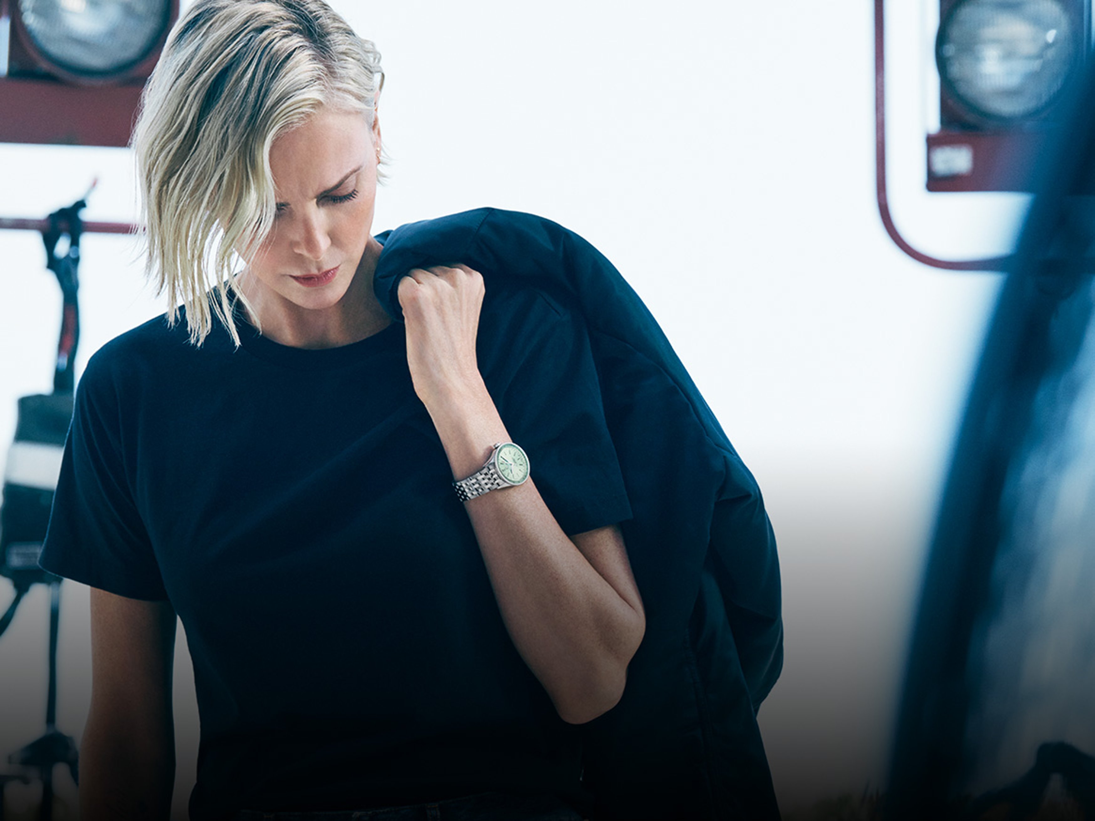 Actress Charlize Theron wears a Breilting watch on her wrist.