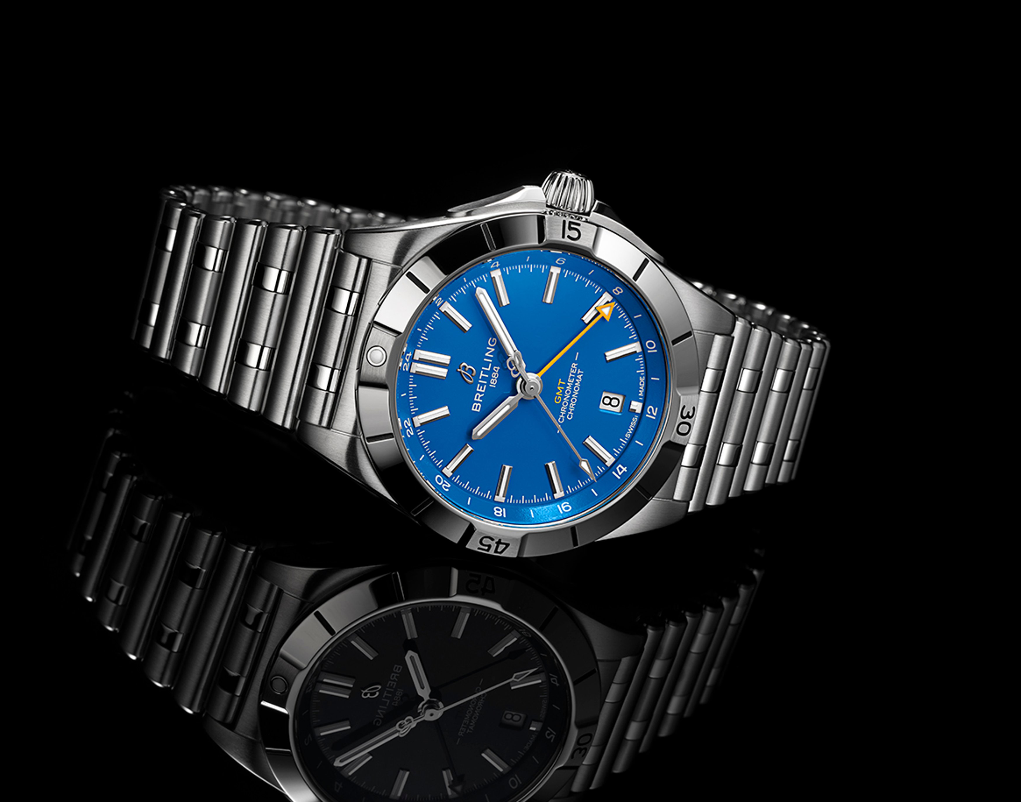 {generated} Breitling Chronomat with a vivid blue dial and steel bracelet reflected on black, echoing Los Angeles Chargers colors.