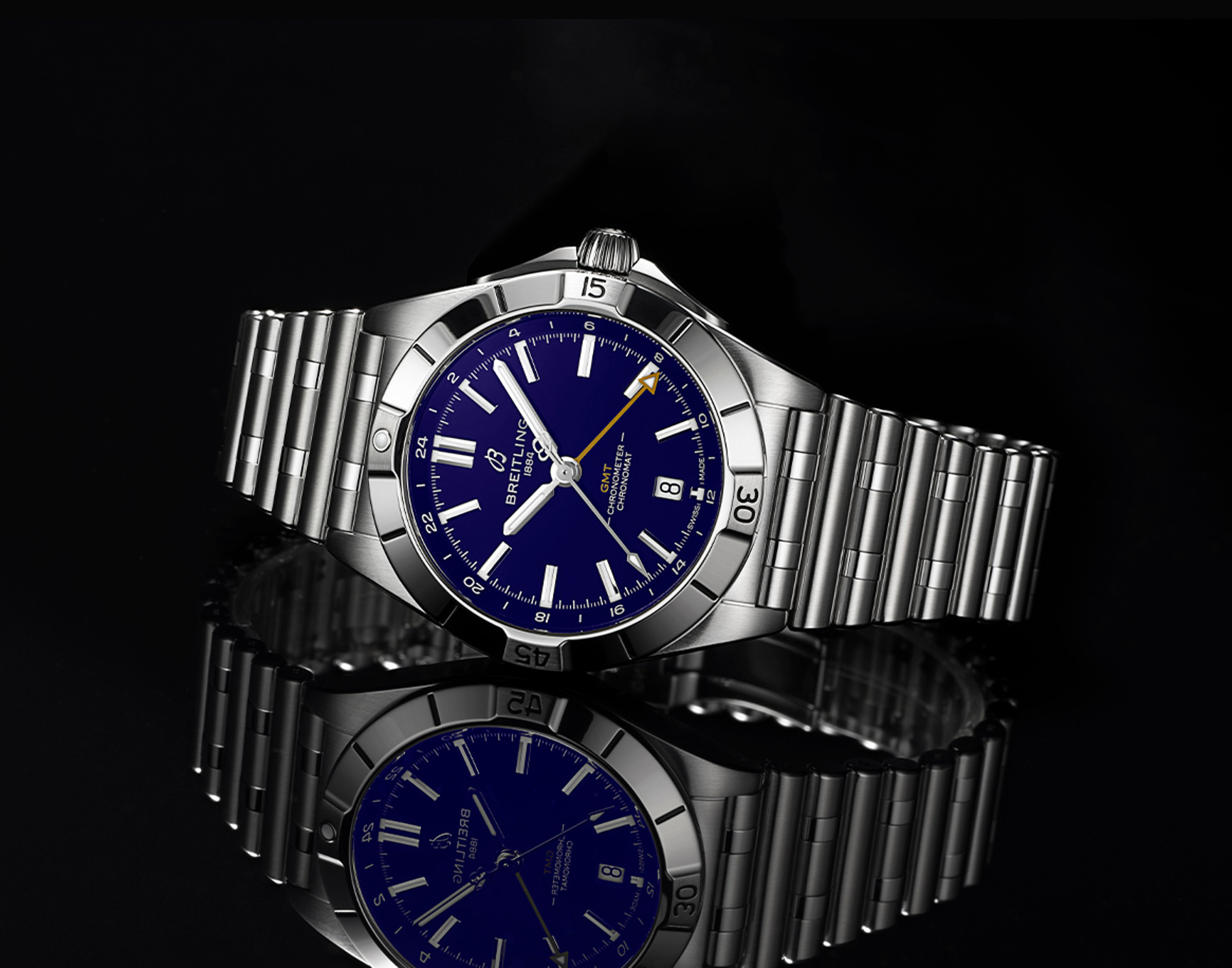 {generated} Breitling Chronomat GMT with deep blue dial and steel bracelet shown in a polished studio setting for Baltimore Ravens.