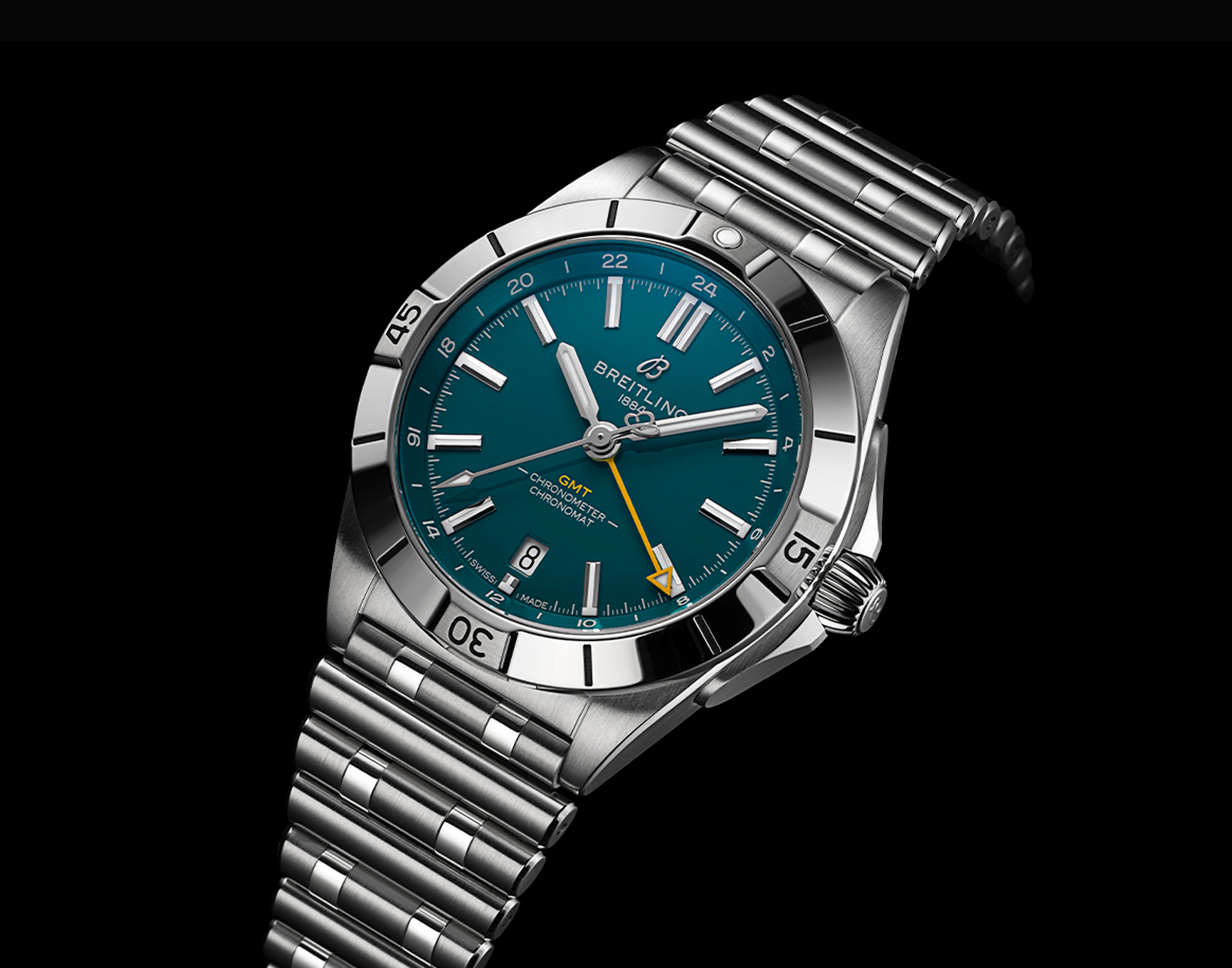 {generated} Breitling Chronomat GMT with teal dial and steel bracelet shown close-up to emphasize its bold detailing and precision
