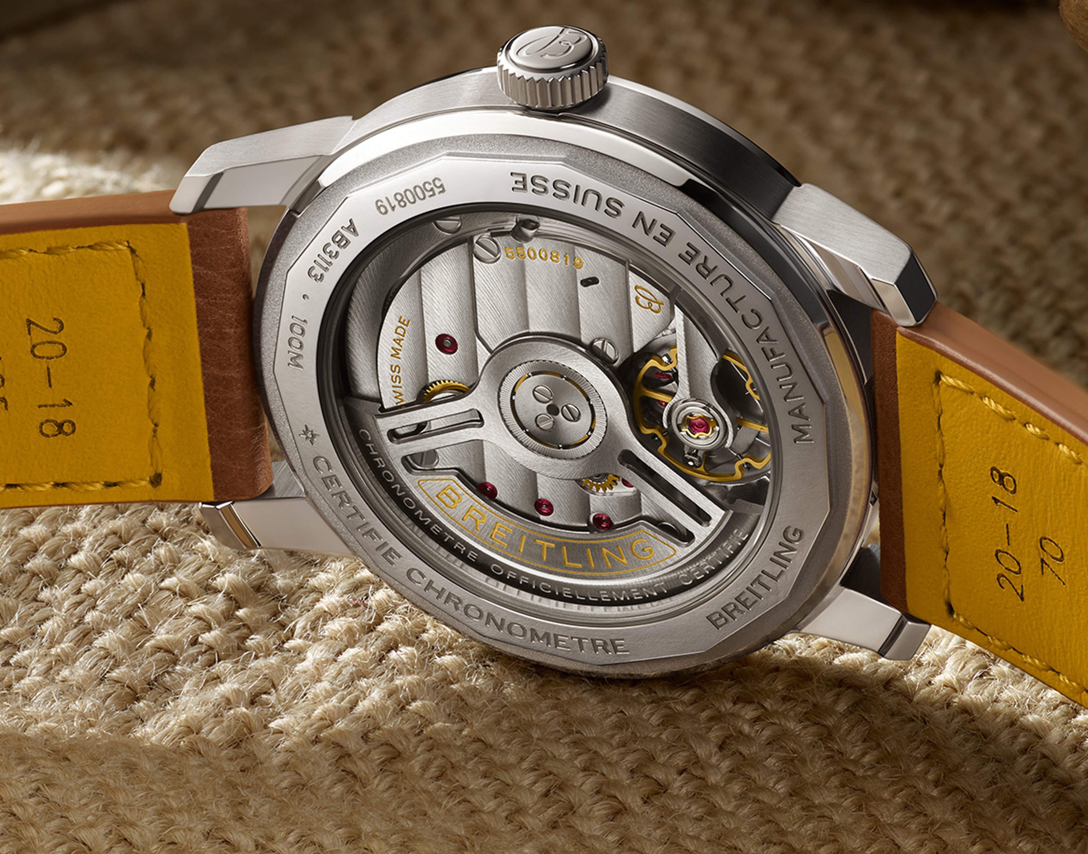 {generated} Breitling watch showcasing the Caliber B31 movement through its transparent caseback and leather strap detailing