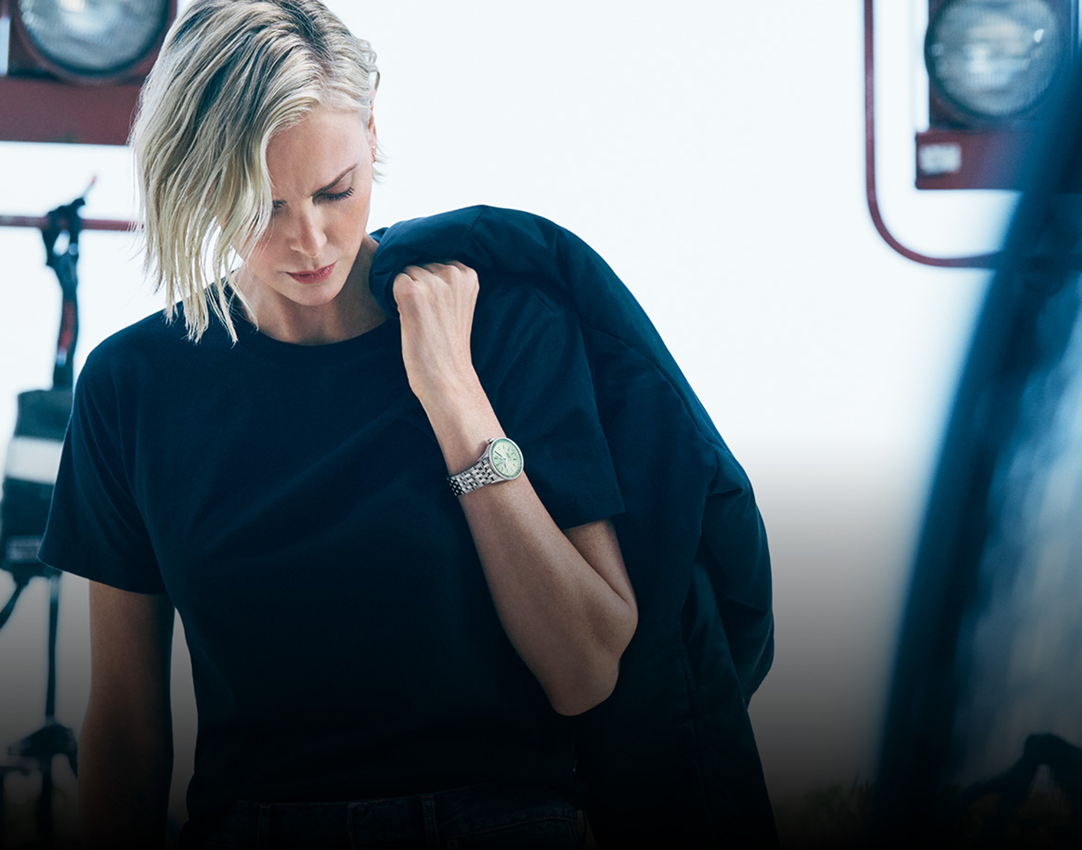 Actress Charlize Theron wears a Breilting watch on her wrist.
