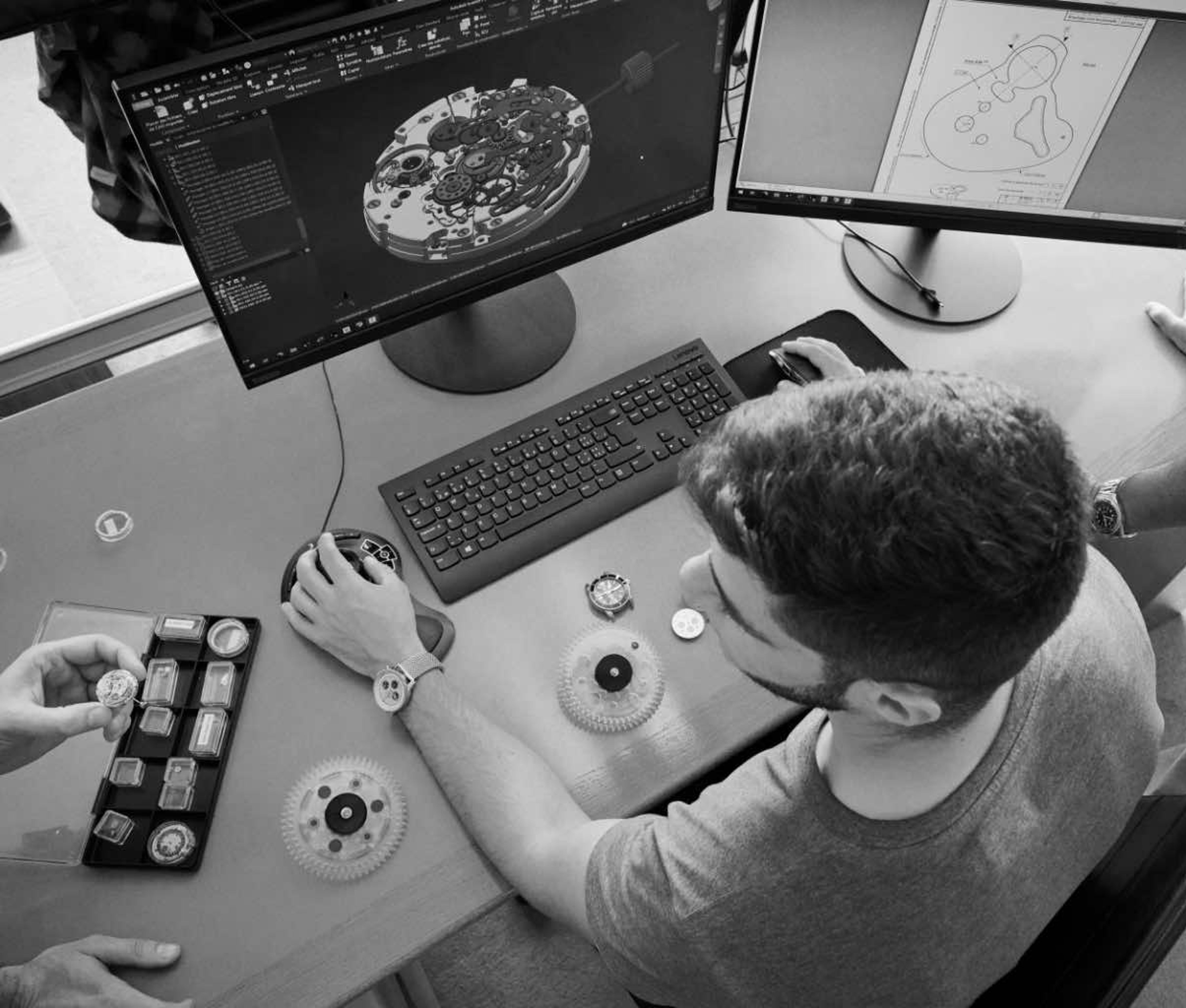 {generated} Engineers collaborate at a workstation reviewing Breitling movement components and patent drawings for precision innovation