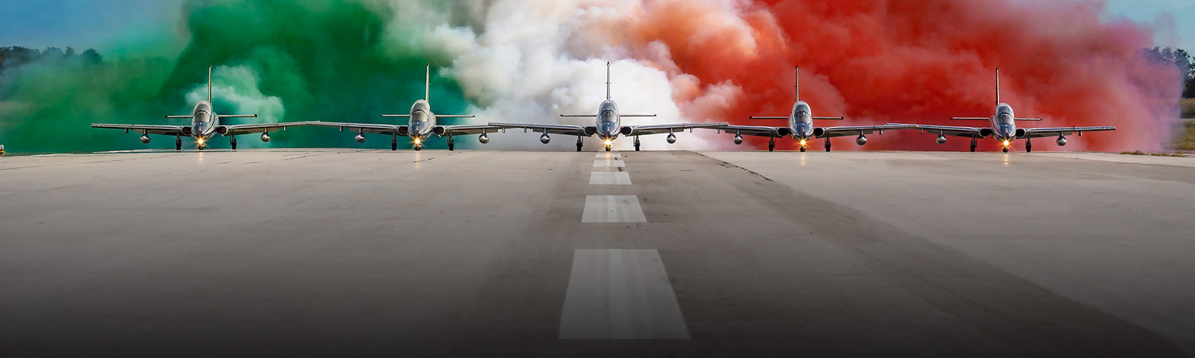 {generated} Frecce Tricolori jets advance on the runway amid green, white, and red smoke, reflecting Breitling’s aviation heritage.
