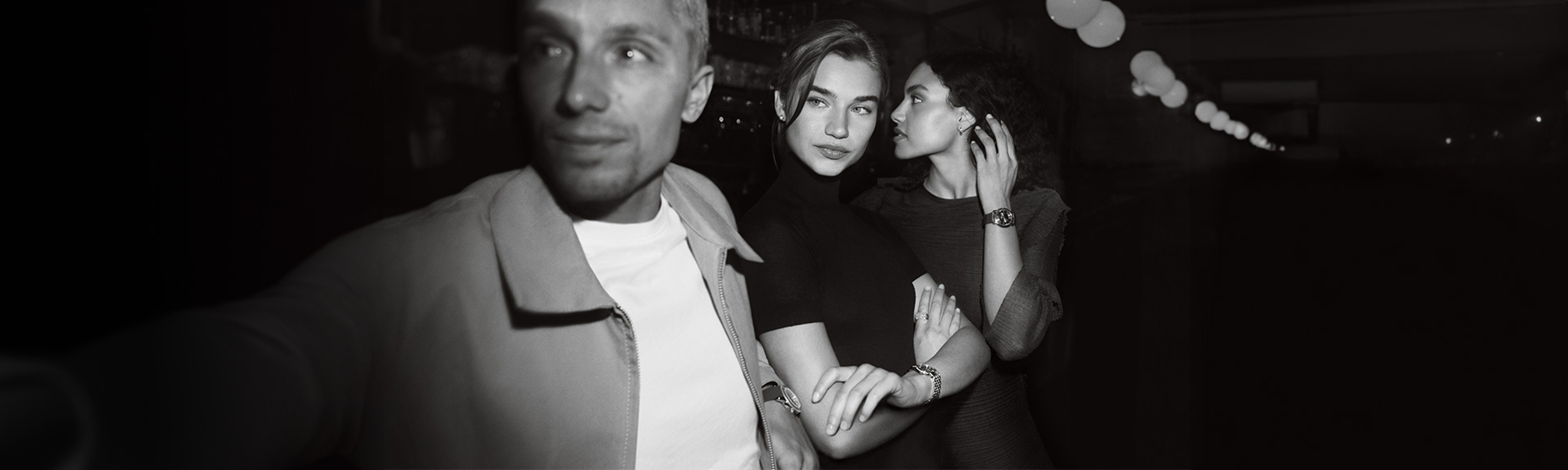 {generated} Women in an evening setting linking arms, showcasing the Breitling Lady Premier watch with elegant refined style.